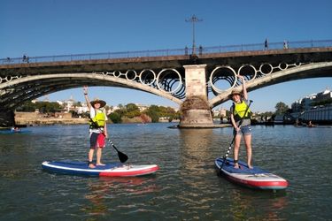 customers in a paddle sur tour on the guadalquivir river in seville