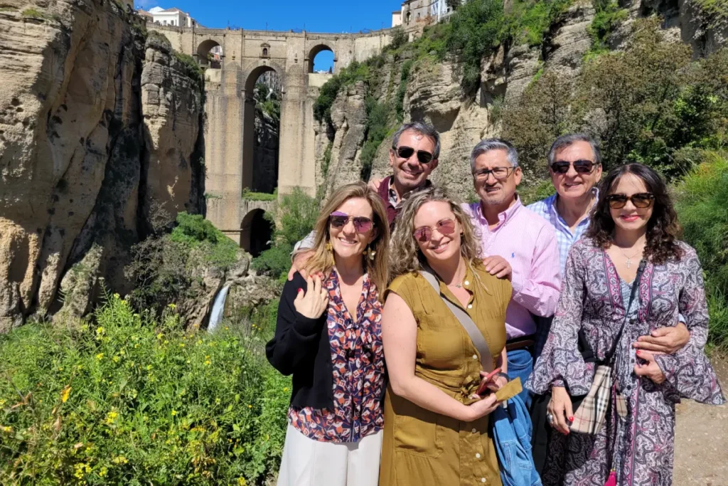 Travelers in front of the Puente Nuevo in Ronda