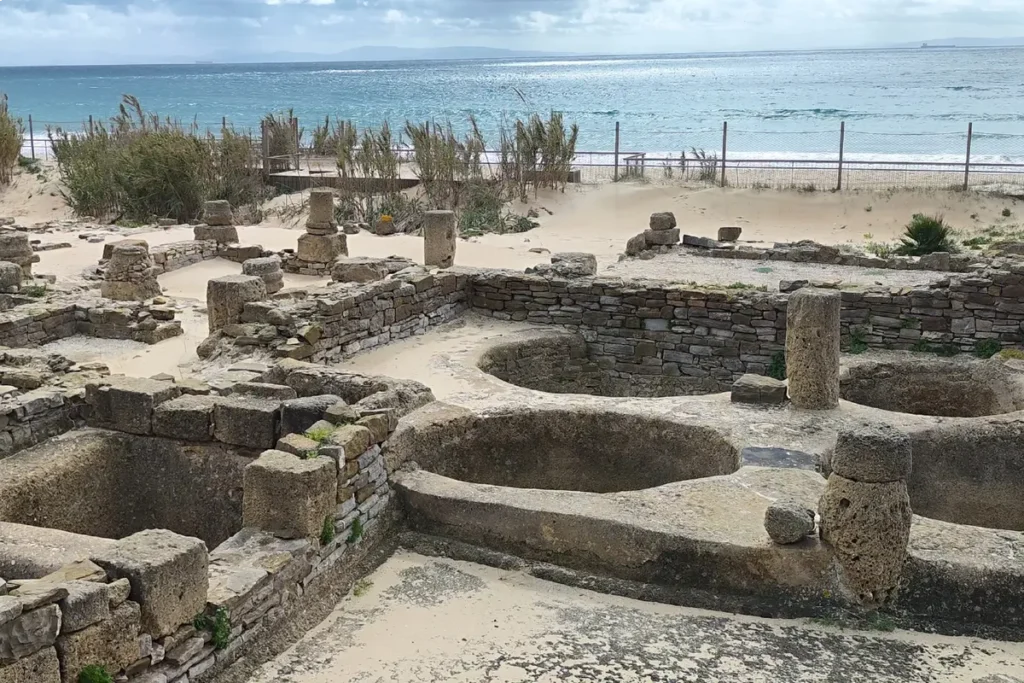 Roman ruins of Baelo Claudia with Bolonia beach and the sea behind
