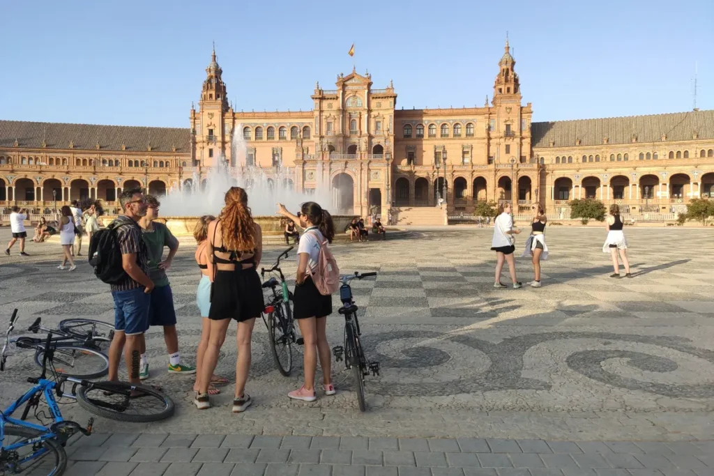 Bicycles resting on the tiled floor of the Plaza de Espana in Seville