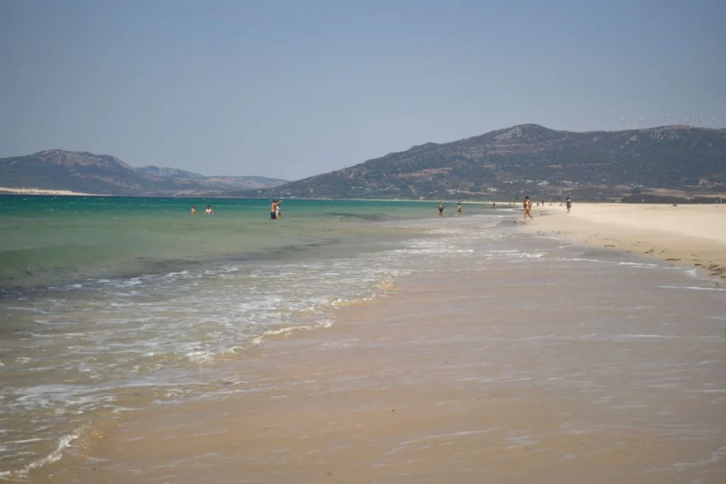 Wide open sand and shallow water on the Atlantic coast near Tarifa