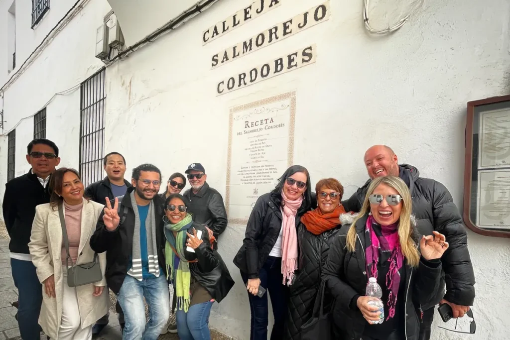 Whitewashed alley in Cordoba with the tiled recipe for salmorejo on the wall