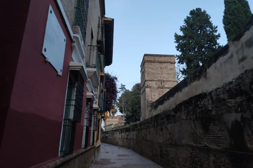 The narrow Callejon del Agua beside the walls of the Alcazar in Seville
