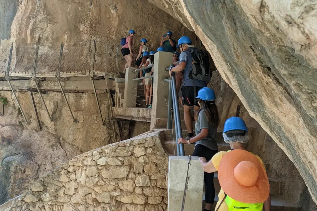 Steps on the Caminito del Rey route, with helmets worn throughout