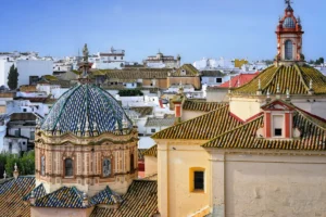 Rooftops of Carmona with a blue and white tiled church dome