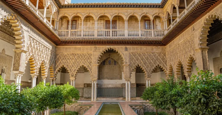 Courtyard of the Maidens with its carved arcade and sunken garden at the Royal Alcazar of Seville