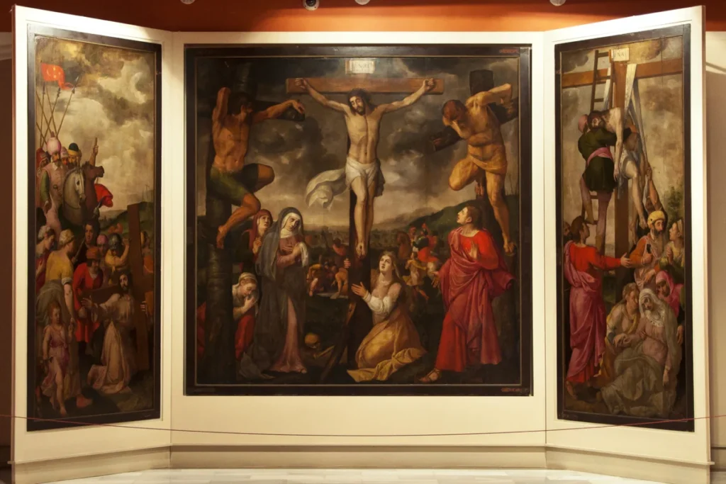 A large crucifixion triptych on display at the Museum of Fine Arts in Seville