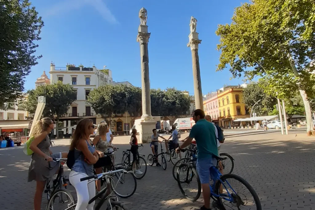 Cyclists gathered by the columns of the Alameda de Hercules in Seville