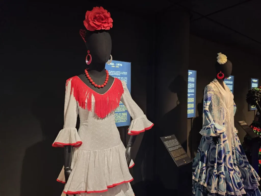 Flamenco dresses displayed on mannequins in a museum in Seville