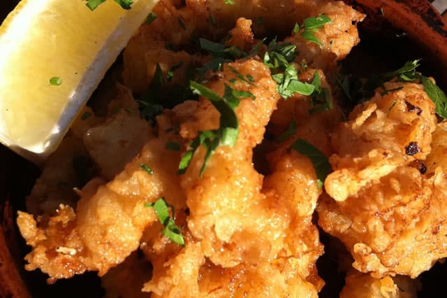A tapa of fried fish with lemon, as served in Seville