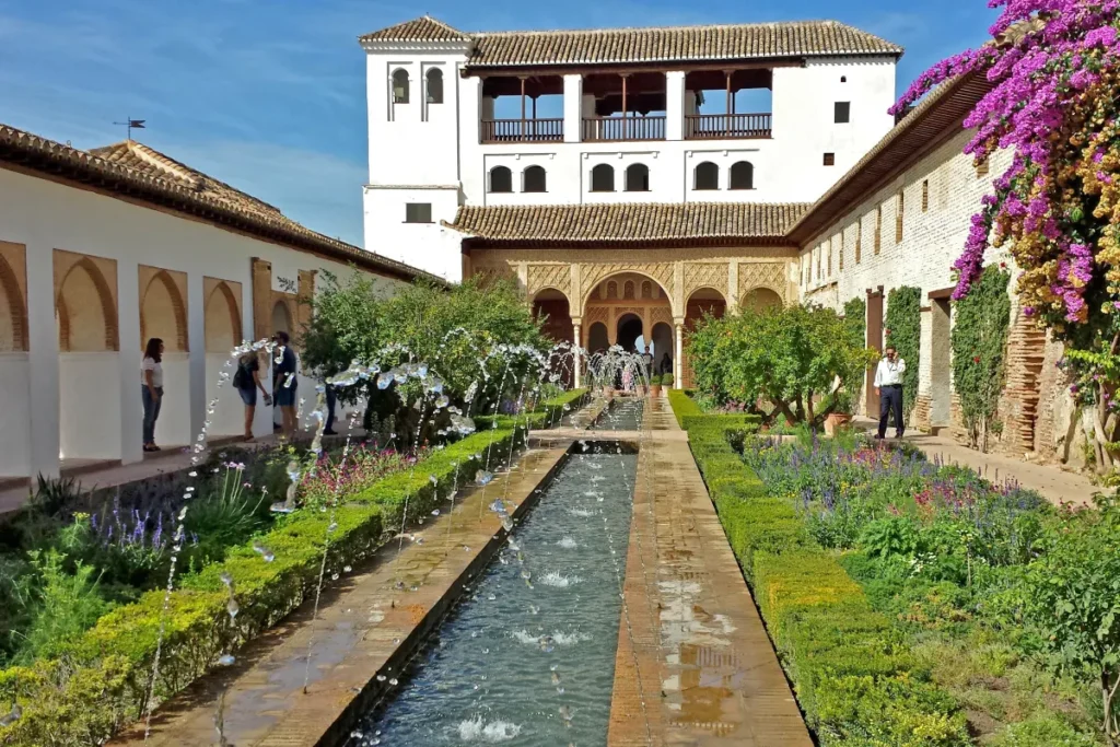 Long water channel and flowerbeds in the Generalife gardens of the Alhambra