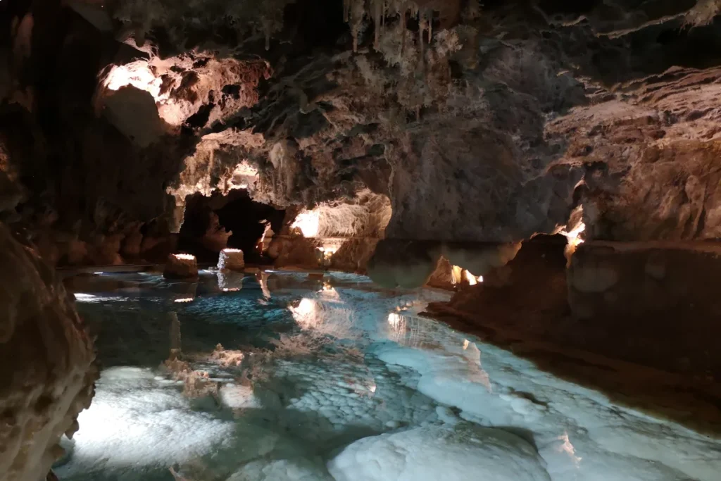 Clear underground lake reflecting the rock in the Gruta de las Maravillas