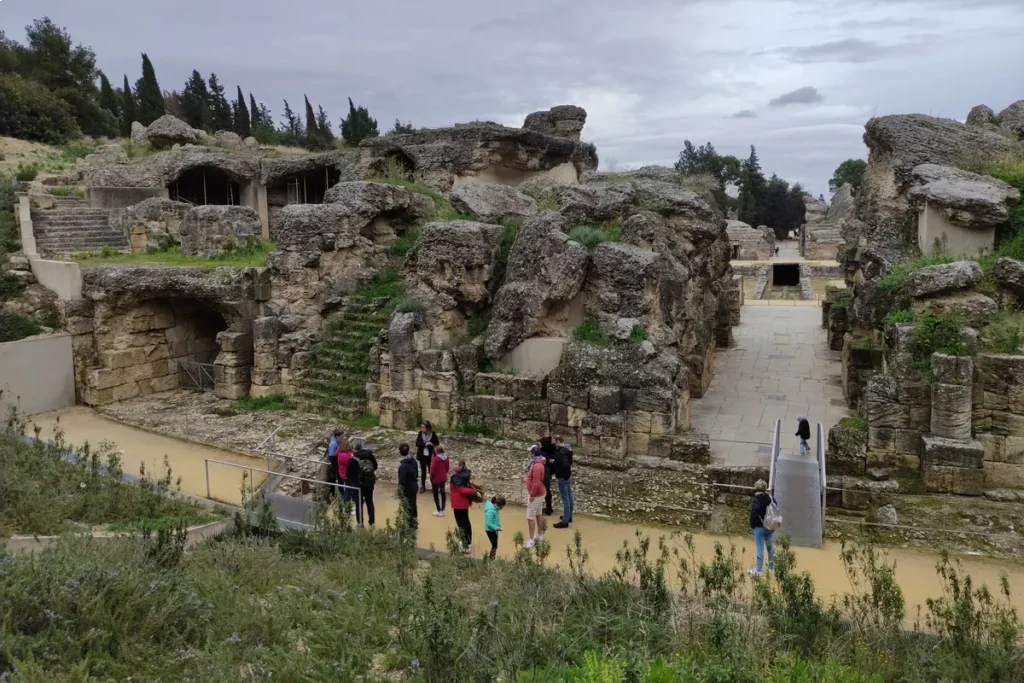 Wide view of the excavated Roman streets and amphitheatre at Italica