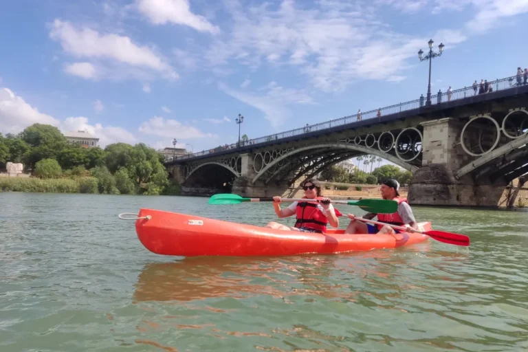 Kayaks on the Guadalquivir in front of the Triana bridge in Seville