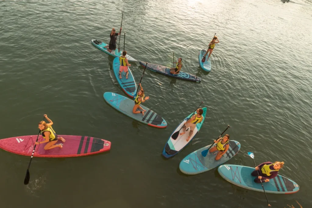Paddleboarders seen from above on the Guadalquivir river in Seville