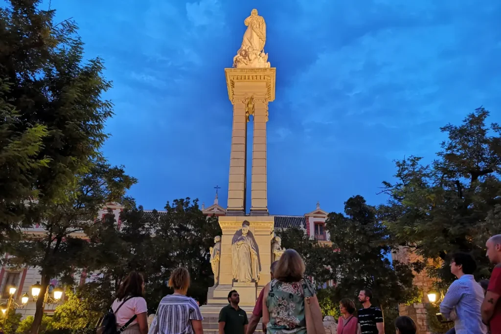 The column of the Immaculate Conception on the Plaza del Triunfo at dusk