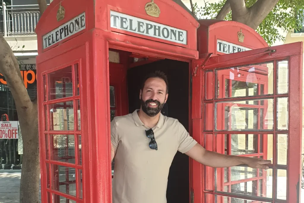 A British red telephone box on a street in Gibraltar