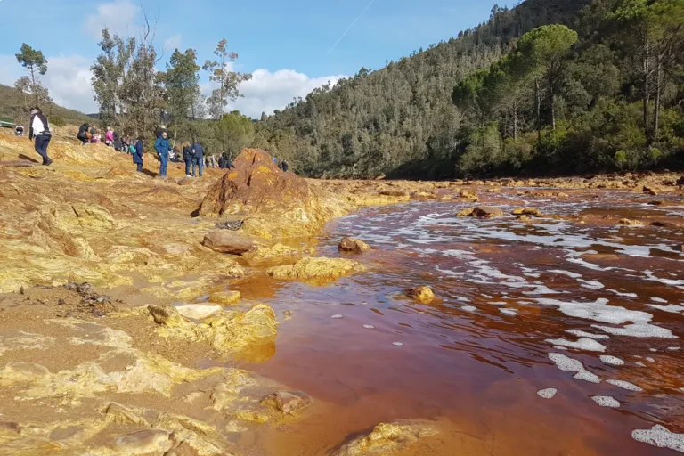 The rust-red water of the Rio Tinto running through the mining landscape