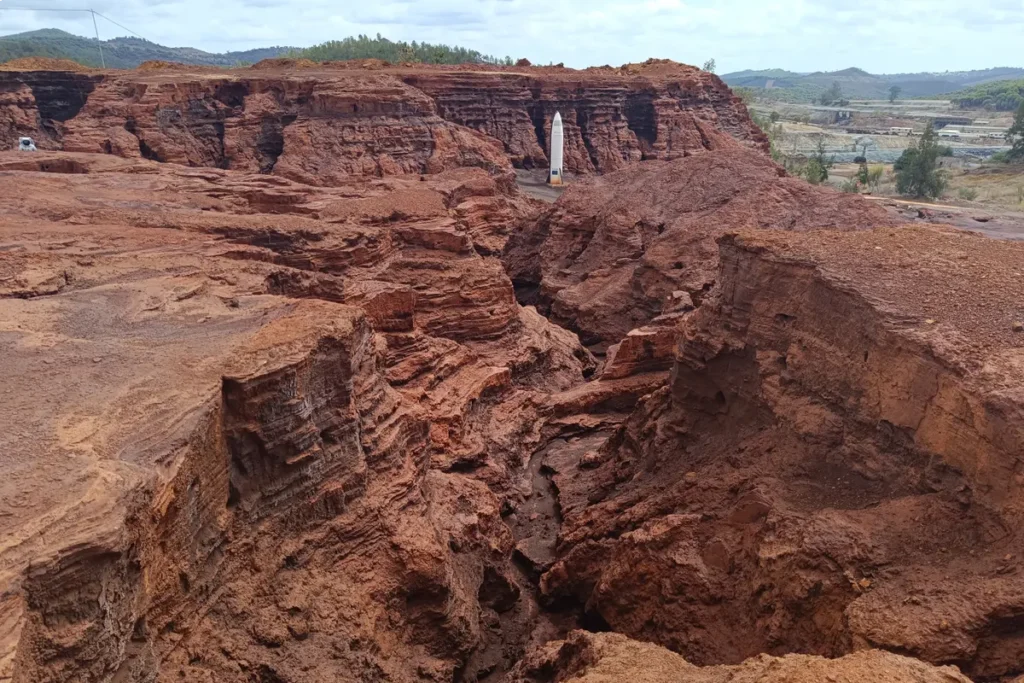 Deep red rock faces cut into the earth at the Rio Tinto mines