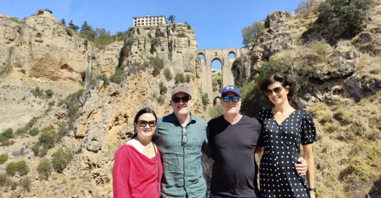 The rock walls of the Ronda gorge with the old bridge arching across it