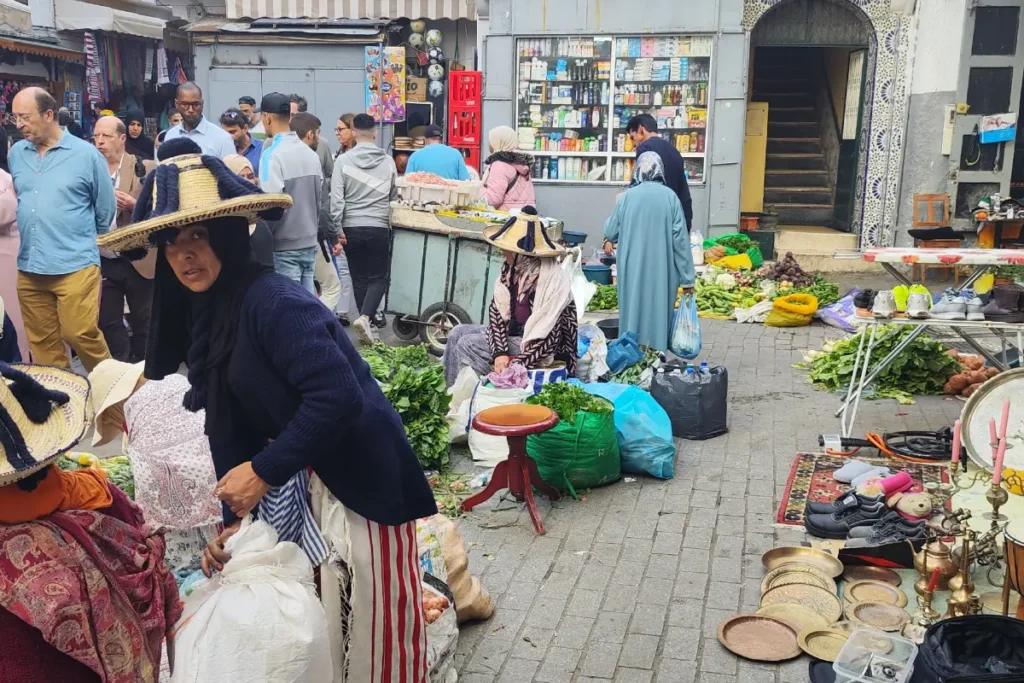 A busy street market in Tangier with stalls spread across the pavement