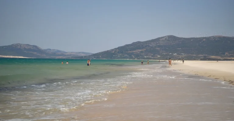 Long sandy beach at Tarifa with the hills of the Costa de la Luz behind