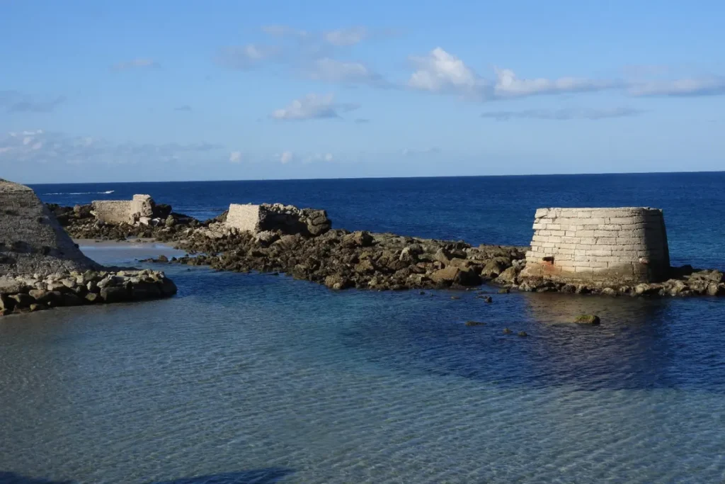 Old coastal fort and causeway reaching out from Tarifa into the sea