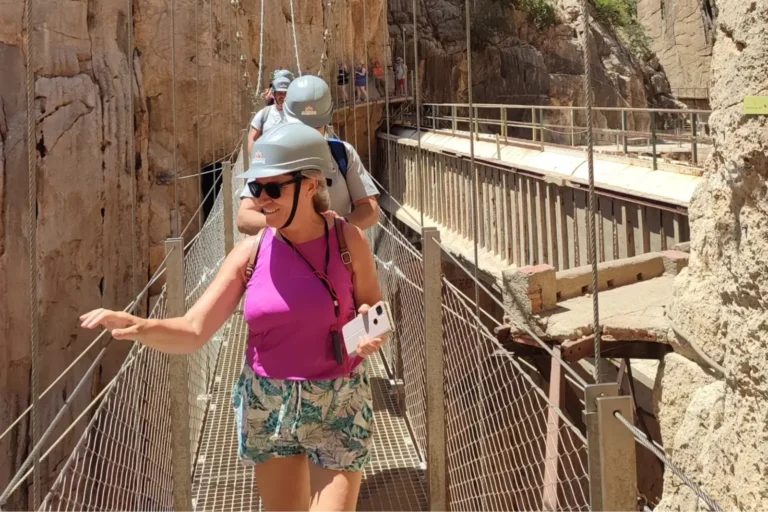 A traveler crossing the hanging bridge at the Caminito del Rey