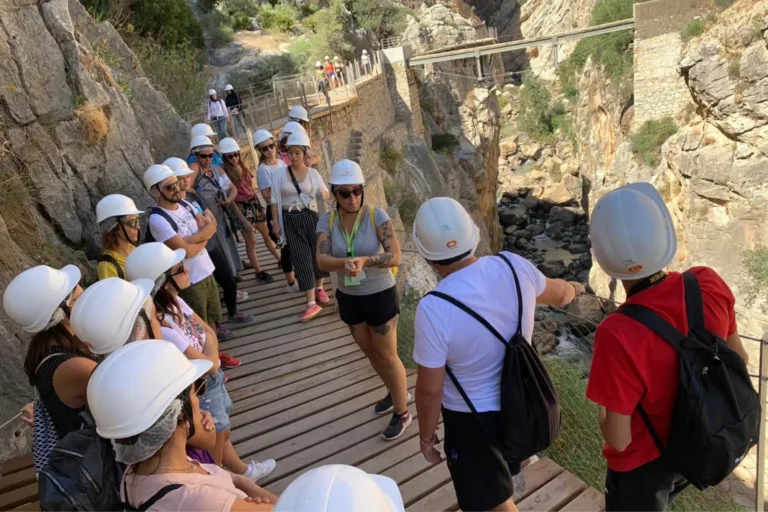 Travelers wearing helmets on the Caminito del Rey walkway